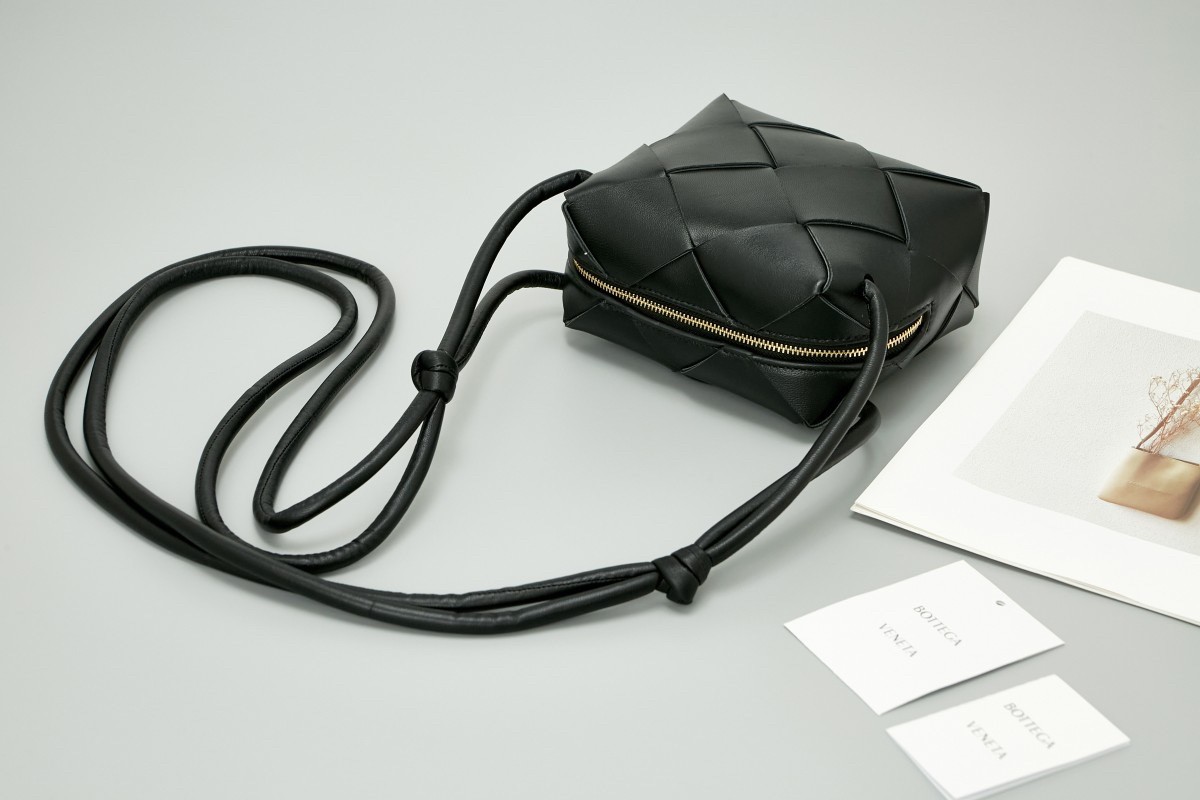 bo*te*ga Ve*ne*ta mini cassette camera bag in black lambskin