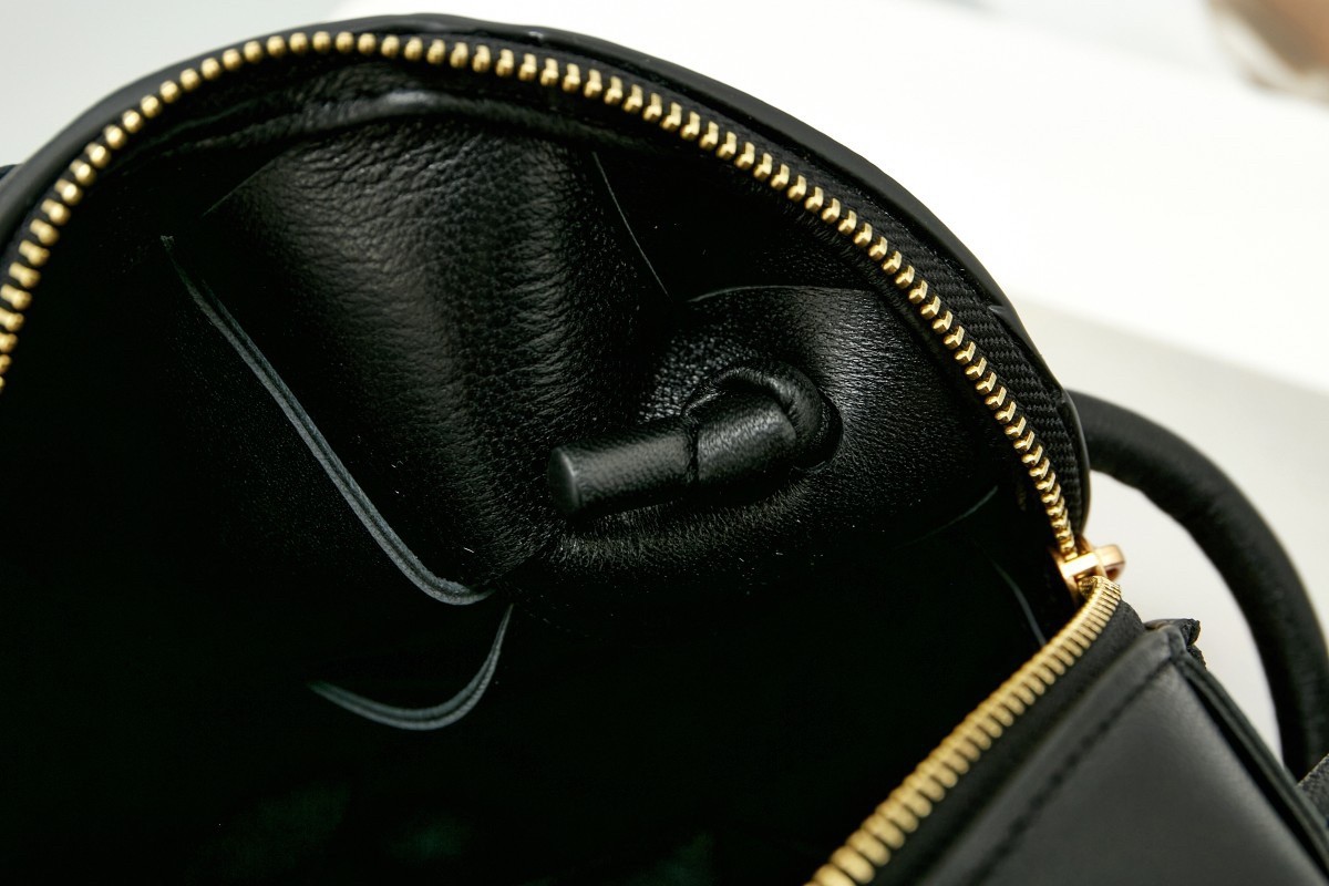 bo*te*ga Ve*ne*ta mini cassette camera bag in black lambskin