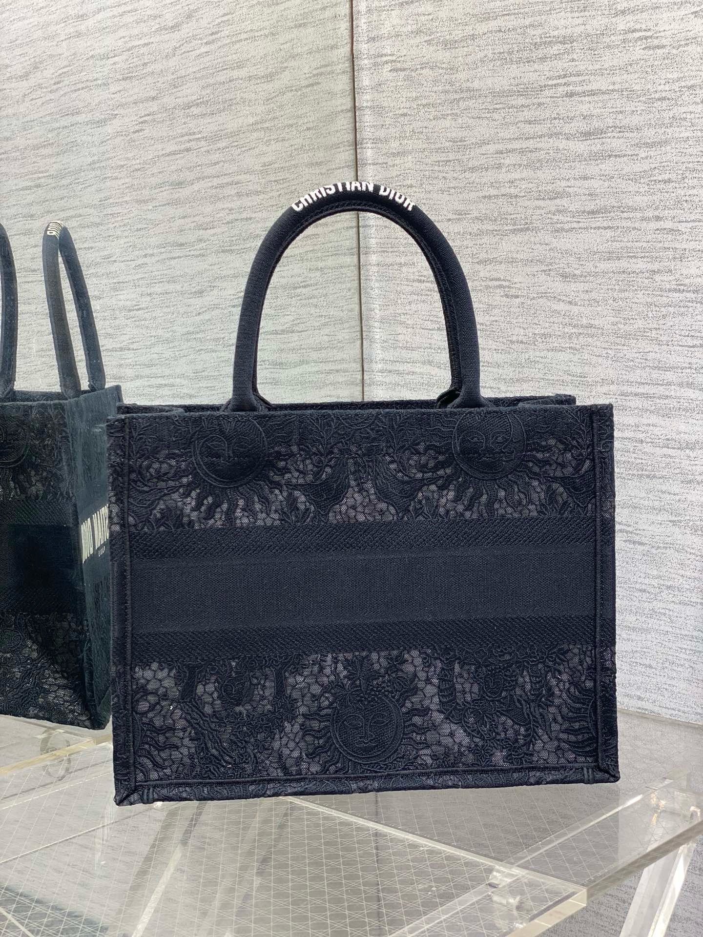 D*or medium book tote bag in black toile de jouy soleil macramé embroidery