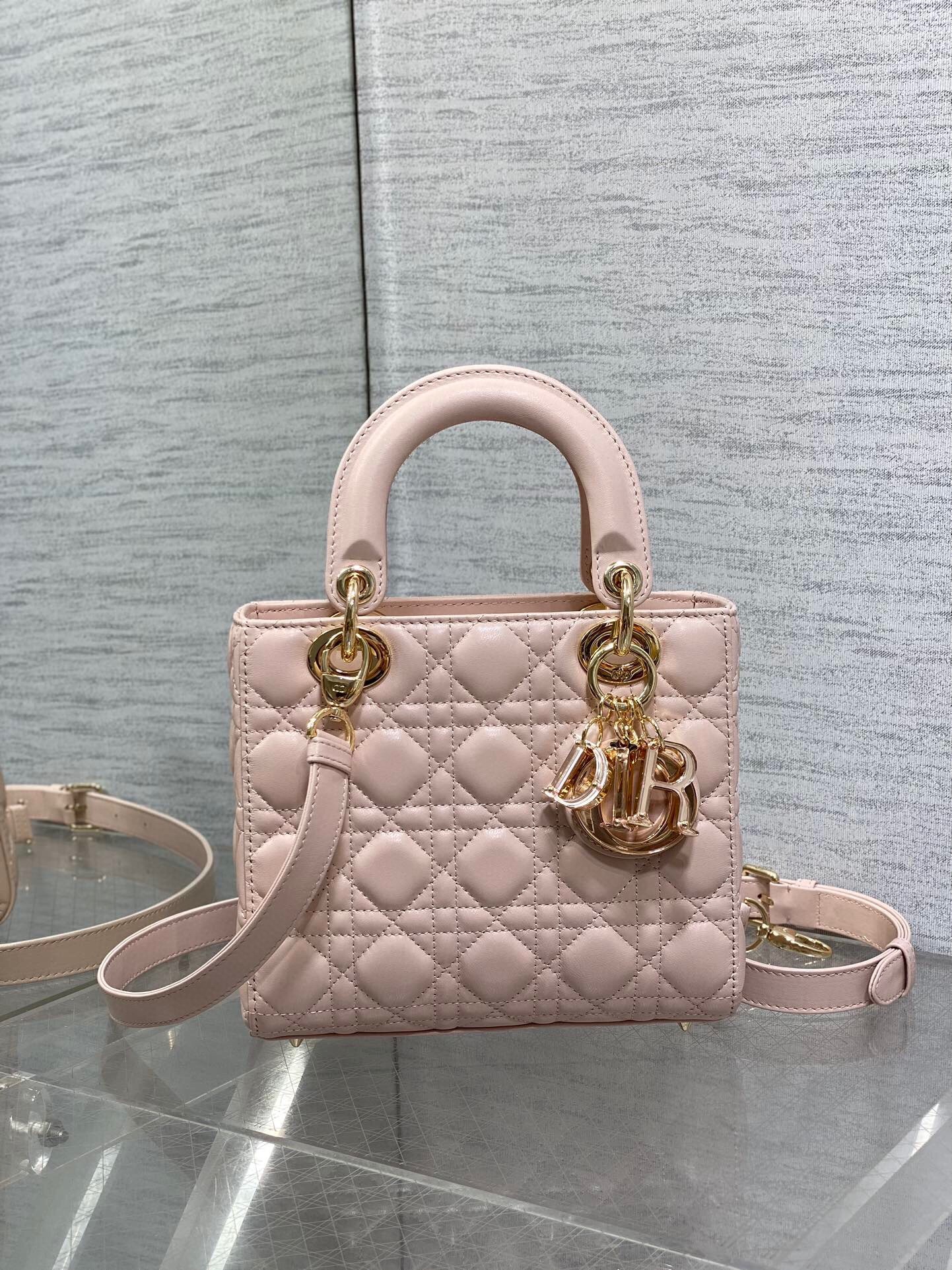 D*or small lady D*or bag in pink lambskin with resin charms