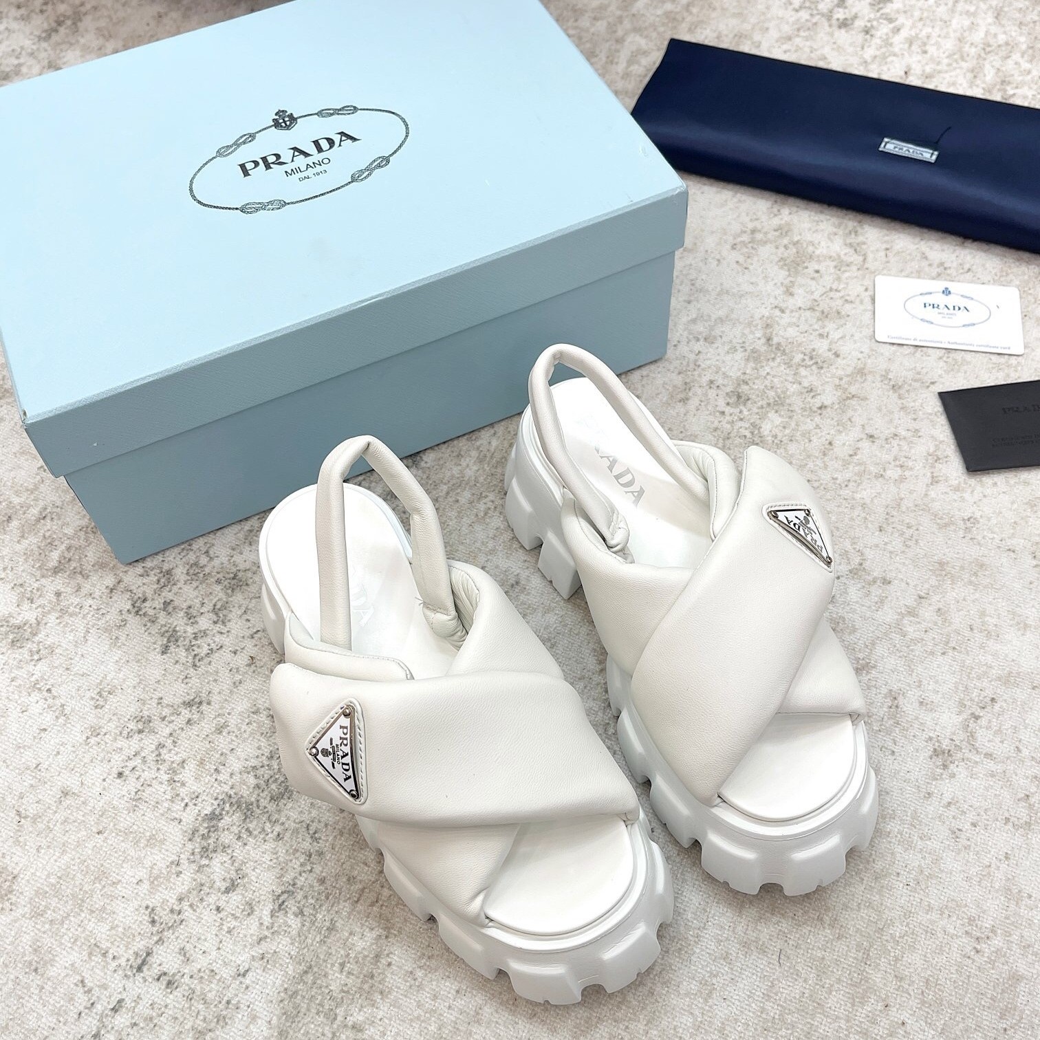 Pra*a monolith padded sandals in white nappa leather