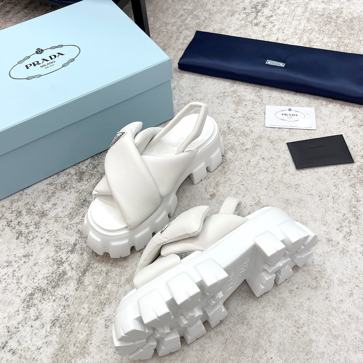 Pra*a monolith padded sandals in white nappa leather