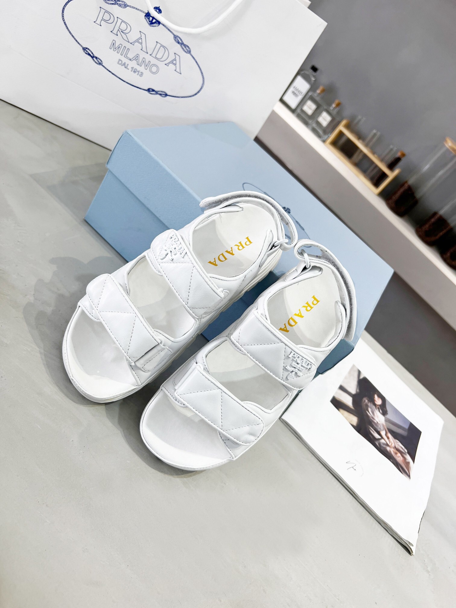 Pra*a padded sandals in white nappa leather